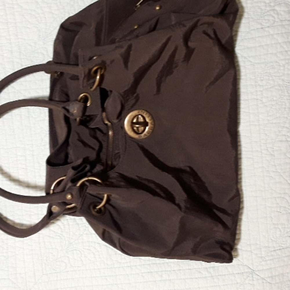 Larg Baggallini purse ,never worn no tags ,Pet free smoke free home.